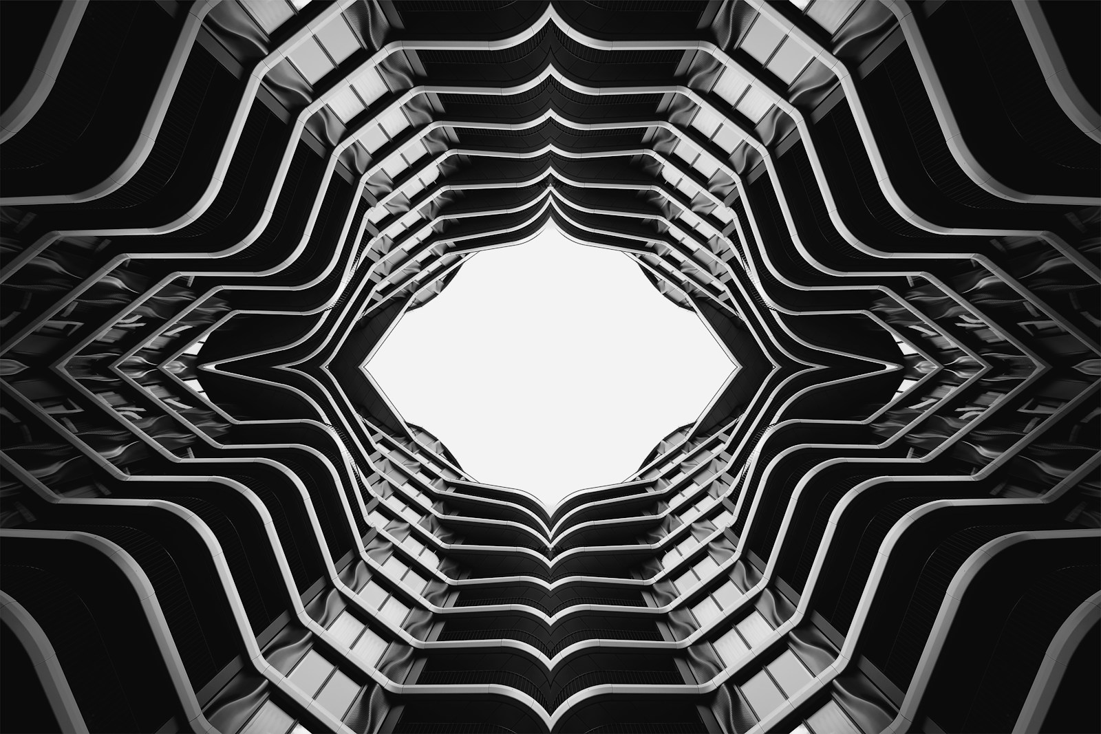 Abstract geometric pattern of building balconies against bright sky